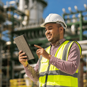 Image of a service technician with a Flat Rate Pricing Book on a Tablet PC